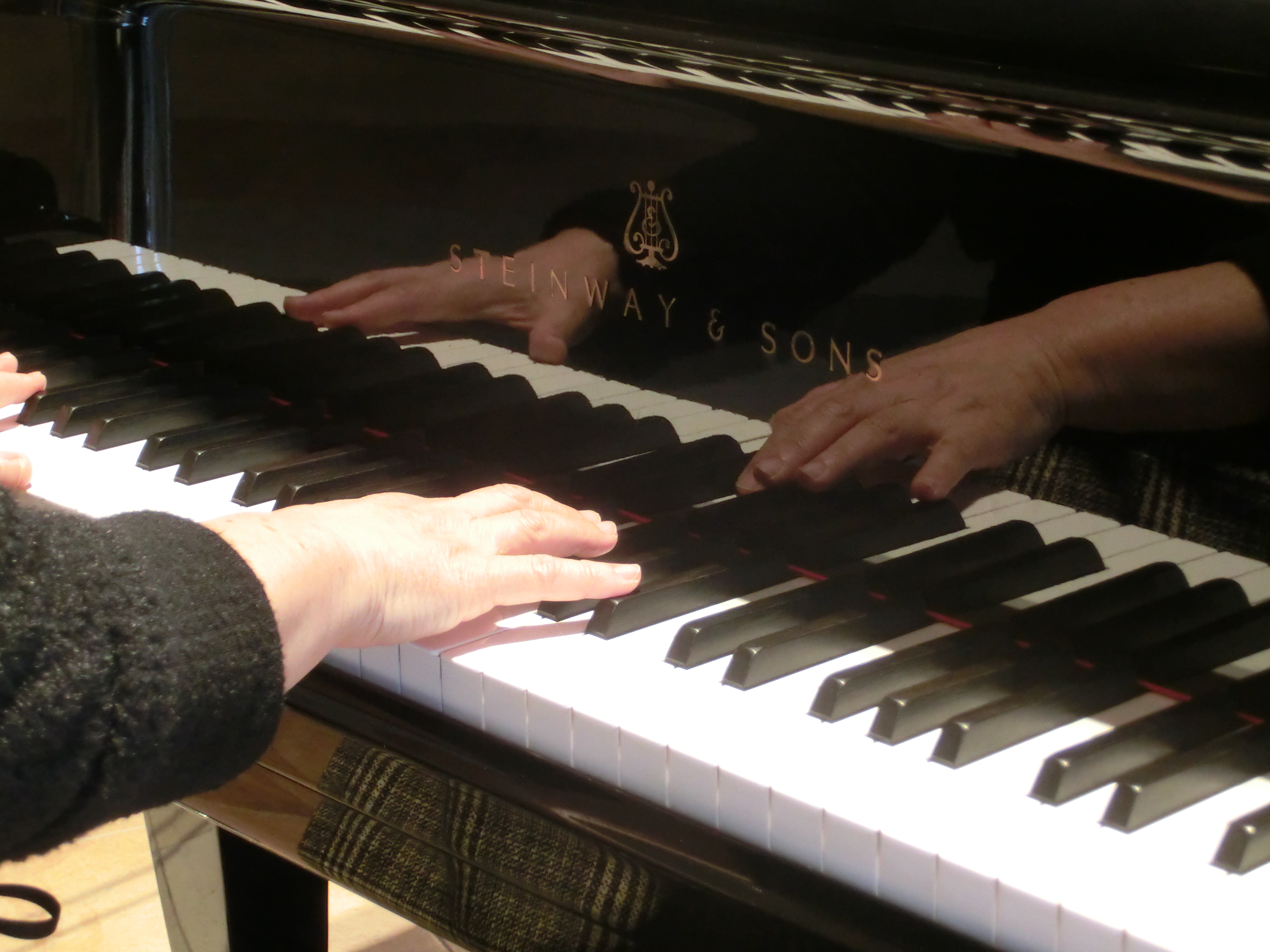 A black Steinway & Sons grand piano , placed in nagasaki brickhall.